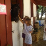 Petting horses (children)